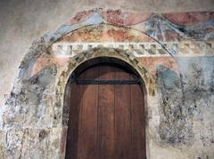 Palau dels Reis de Mallorca king's chamber door with mural decoration