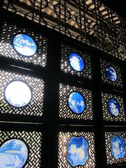 Courtyard wall with intricate glass artwork