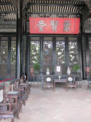 ancient Chinese architecture with intricate wooden carvings and red lanterns