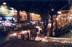 Chiang Mai Night Bazaar at night with colorful lights and people shopping