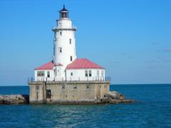 Chicago Harbor Light by Lake Michigan with the city skyline in the background