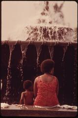 Visitors cooling off beside a fountain at Philadelphia Museum of Art