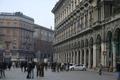 Piazza Duomo in Milan with Galleria Vittorio Emanuele II on the right and Broletto Nuovo in the background