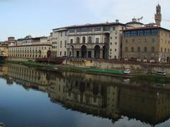 The Uffizi Gallery reflecting in the Arno river in Florence, Italy