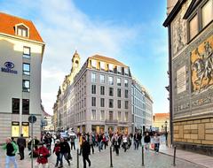 View from Augustusstraße into Töpferstraße in Dresden with Frauenkirche in the background and Hilton Hotel on the left