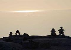 silhouettes of inukshuk in Colonel Samuel Smith Park Toronto