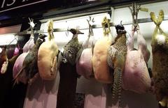 butchery in Oxford covered market with hanging meats