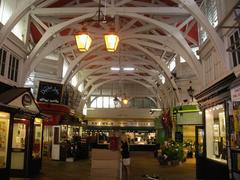 Inside Oxford's Covered Market with various shops and people