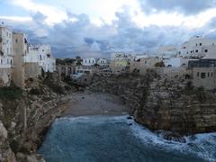 View of Lama Monachile beach and bridge in Polignano a Mare, Italy