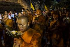 Buddhist followers making merit at Wat Chedi Luang in Chiang Mai on Visakha Bucha Day