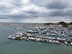 Otranto harbor with Torre Matta in the foreground, part of Italy's cultural heritage