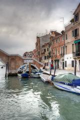 Venice canal with gondolas and historic buildings