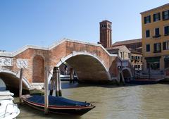 Bridge over the Canale di Cannaregio with historic buildings and tourists in Venice