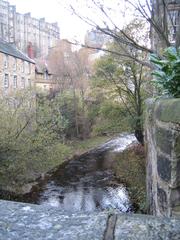 Dean Village in Edinburgh with historic buildings and greenery