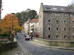 Scenic view of Dean Village with historic buildings and Water of Leith in Edinburgh