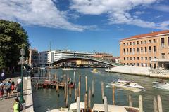 View of the Grand Canal east bank at Fondamenta de la Croce from Ponte de la Croce in Santa Croce, Venezia, Italy