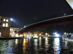 Ponte della Costituzione in Venice with tourists walking at sunset