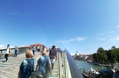 Ponte della Costituzione bridge with people crossing in Venice