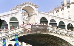 Grand Canal in Venice with gondolas and tourists during the day