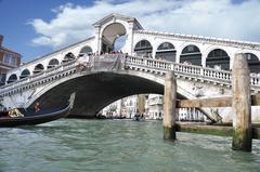 Grand Canal in Venice with gondolas and tourists