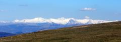 Panoramic view of snow-capped Sibillini Mountains from Monte Subasio summit