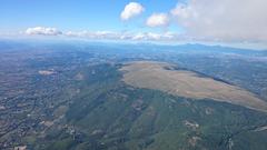 Aerial view of Monte Subasio with green hills and valleys