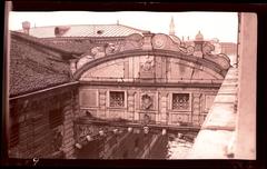 Venice's Bridge of Sighs, enclosed stone bridge with statues and carved bars