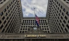 Upward view of Cadillac Place main entrance in Detroit with classical detailing