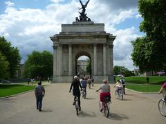 Bicyclists approach Wellington Arch in London