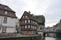 Scenic view of L'Ill river in Strasbourg, Alsace, France with historic buildings along the riverbank