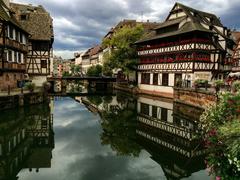 mirrored building in a cityscape reflected on water