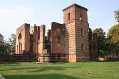 Dilkusha Kothi ruins in Lucknow, India, with towers and external walls amidst gardens