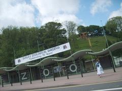 Dudley Zoo entrance with visitors and a 70th anniversary sign