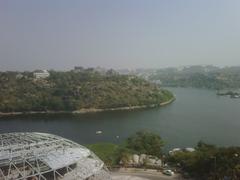 Durgam Cheruvu lake with surrounding greenery