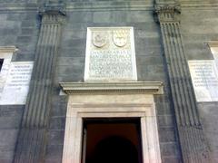 Engravings on the entrance door of the side facade of the Pontano Chapel in Naples