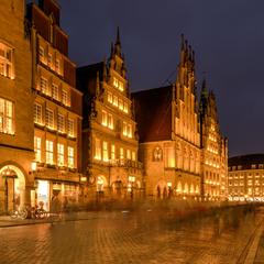 Christmas decorations at Prinzipalmarkt with Stadtweinhaus and historic town hall in Münster