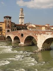 Ponte Pietra Roman bridge with watchtower and Verona Cathedral bell tower