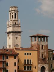 Wachturm an der Ponte Pietra in Verona with the bell tower of the Cathedral of Verona in the background