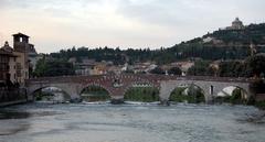 Ponte Pietra bridge with Mastino Tower and San Leonardo Fort in the background