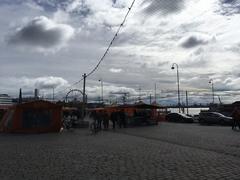 Helsinki cityscape in 2018 featuring iconic buildings, the harbor, and boats.