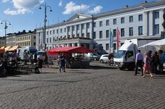 Panoramic view of Helsinki with coastal buildings and lush greenery