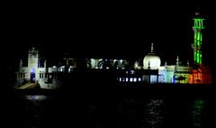 Haji Ali Dargah night view with colorful reflection in the Arabian Sea