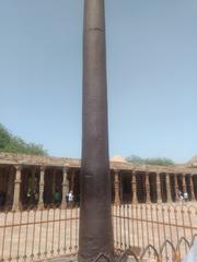 Historic iron pillar at Qutub Minar in Delhi