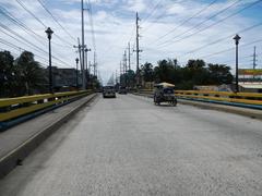 Tabing-Ilog Barangay public market area with vehicles in Marilao, Bulacan