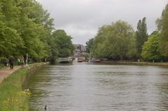 Folly Bridge from towpath with white post marking University of Oxford Torpids and Eights finish line