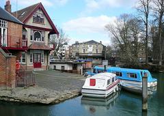 Head of the River pub by the river with people sitting outside