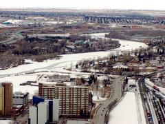 view from Calgary Tower in Calgary, Canada showcasing cityscape and distant mountains