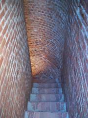 Fort Clinch historic brick building with a flag, surrounded by lush greenery