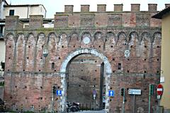 Ancient stone gate Porta a Ovile in Siena, Italy