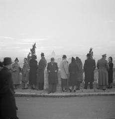 Sunset view from Pincio with St. Peter's Basilica and people in December 1937